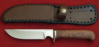 # B-001. Hunting knife. 5.5". D2. 62 HRC. Bronze. Stabilized Rosewood.