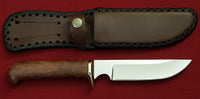 # B-001. Hunting knife. 5.5". D2. 62 HRC. Bronze. Stabilized Rosewood.