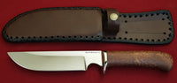 # B-002. Hunting knife. 6.3". D2. 62 HRC. Bronze. Stabilized Rosewood.