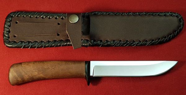 # B-024. Hunting knife. 5.2". 440C. 59 HRC. Micarta Guard. Walnut Wood Handle.